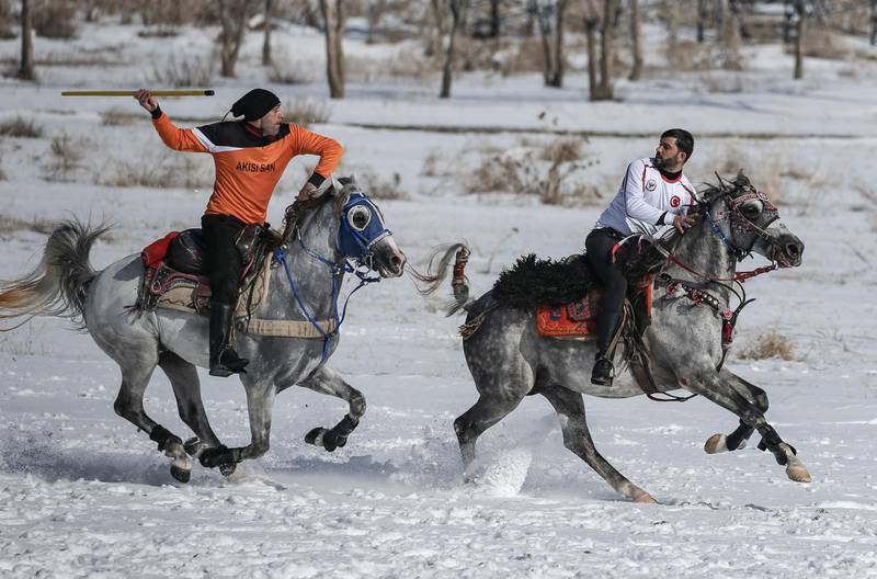 A jereed player in full pursuit of an opponent in Erzurum, Turkey. In the past, an elite class of cavalry was formed from skilled jereed players. EPA