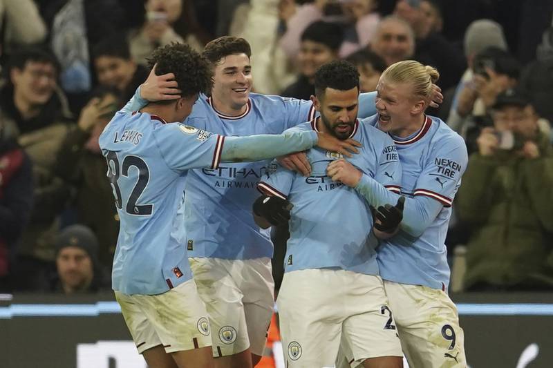 Riyad Mahrez celebrates with teammates after scoring Manchester City's third goal in the 4-2 Premier League  victory against Tottenham at the Etihad Stadium on January 19, 2023. AP