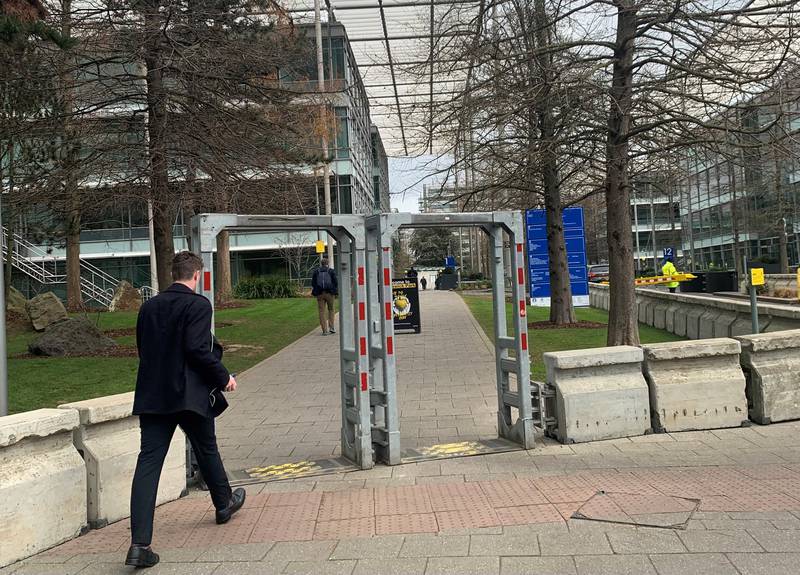 A man walks through tight security at Chiswick Business Park where Iran International's newsroom was based. Photo: The National