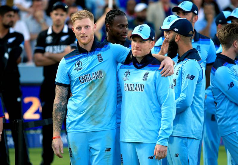 England's Ben Stokes, left, and with captain Eoin Morgan after winning the 2019 World Cup. Morgan retired from international cricket at the start of July. PA