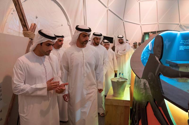 AL MARYAH ISLAND, ABU DHABI, UNITED ARAB EMIRATES - October 15, 2017: HH Sheikh Hamed bin Zayed Al Nahyan, Chairman of the Crown Prince Court of Abu Dhabi and Abu Dhabi Executive Council Member (2nd L), attends the inauguration of the Countdown to Zero: Defeating Disease global exhibition. Seen with Nassar Al Mubarak, a Crown Prince Court of Abu Dhabi staff member (L).

( Mohamed Al Hammadi / Crown Prince Court - Abu Dhabi )
---