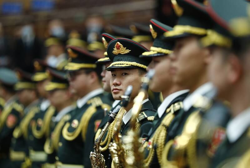 Members of the military band stand during the opening ceremony of the congress. EPA