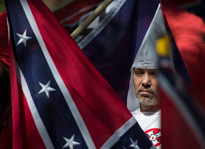 A member of the Ku Klux Klan during a rally, calling for the protection of Southern Confederate monuments, in Charlottesville, Virginia.
Thousands of white nationalists, including supporters of the Ku Klux Klan white supremacist group, and anti-fascist activists are clashing in the city. Andrew Caballero-Reynolds / AFP.