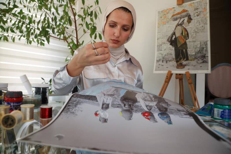 Jordanian artist Dana Barqawi is restoring old images of Palestinians. Reuters
