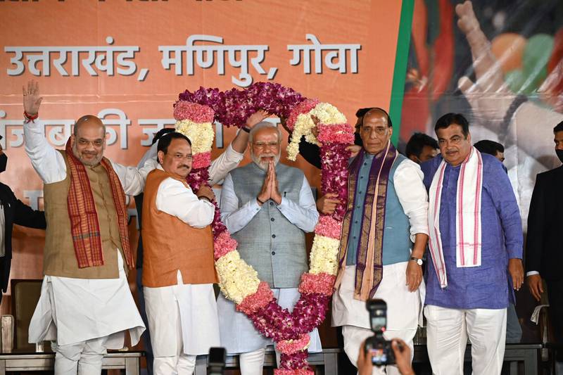 Indian Prime Minister Narendra Modi is felicitated at the BJP headquarters in New Delhi last March. AFP
