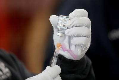 Michael Contreras, Los Angeles Fire Department (LAFD) firefighter paramedic, prepares a Moderna COVID-19 vaccination to be given to LAFD personnel at Station 4 in Los Angeles, California, USA.  EPA