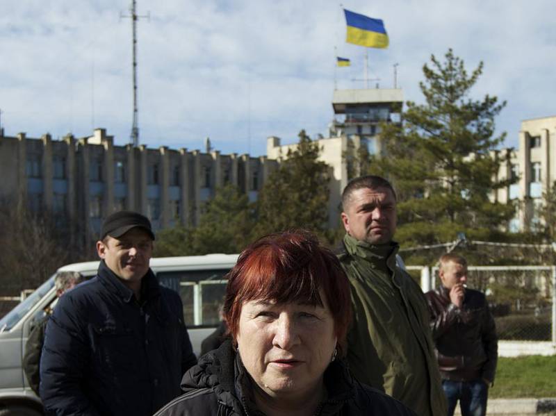 Town residents gather outside the Ukrainian naval base headquarters in Novo-Ozerne, Ukraine, on Monday March 3, 2014. Ivan Sekretarev / AP photo