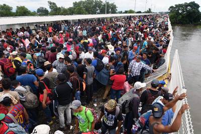 Crowds wait to make the crossing. AFP