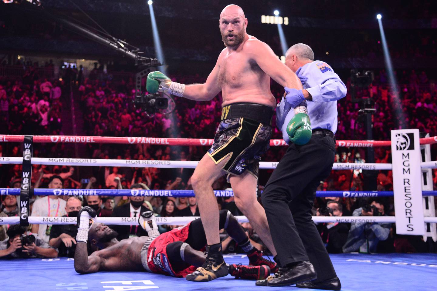 Deontay Wilder is knocked down by Tyson Fury in the 11th round for the third time in the fight. Reuters