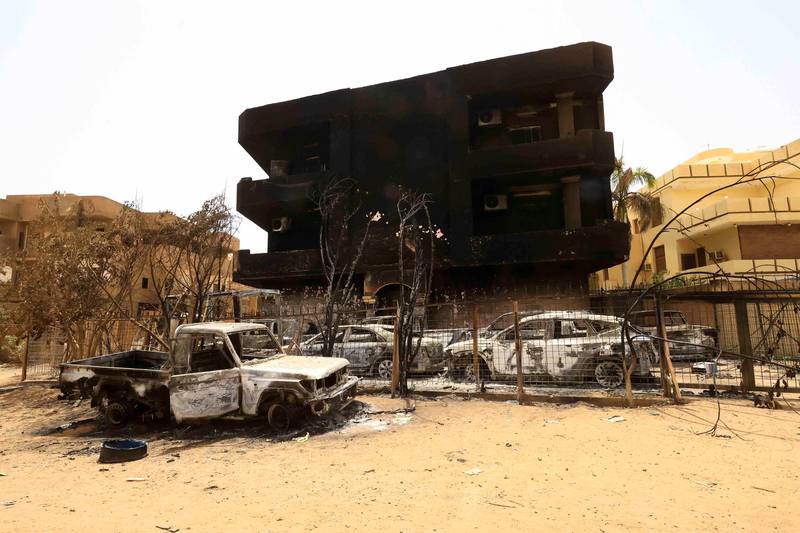 Burnt-out cars during clashes between the RSF and the army in Khartoum. Reuters
