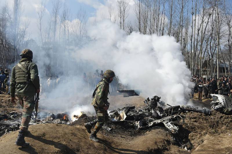 Indian soldiers inspect the remains of an Indian Air Force aircraft after it crashed in Budgam district, 30km from Srinagar.  AFP