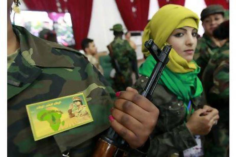 Female volunteer government fighters attend a women's forum in Tripoli. Reuters
