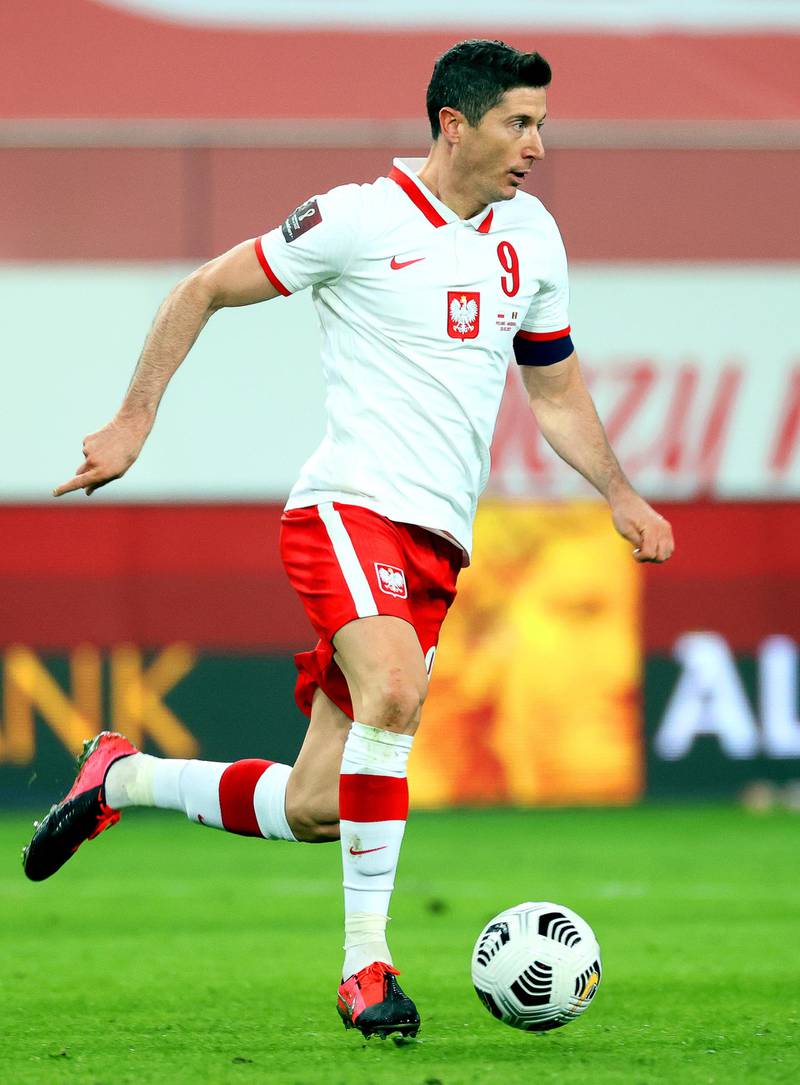 Poland's Robert Lewandowski on the attack in their 3-0 win. EPA