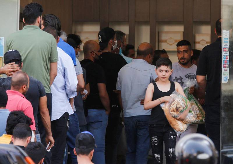 People queue to buy bread at a bakery in Beirut, Lebanon. REUTERS