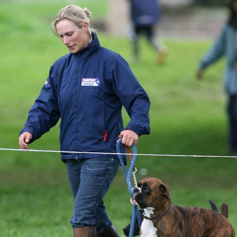 CHATSWORTH, ENGLAND - MAY 14:  Zara Phillips walks the cross country course with her two dogs on the second day of the Chatsworth SsangYong Horse Trials May 14, 2006 in Chatsworth, England.  (Photo by Ben Stansall/Getty Images)