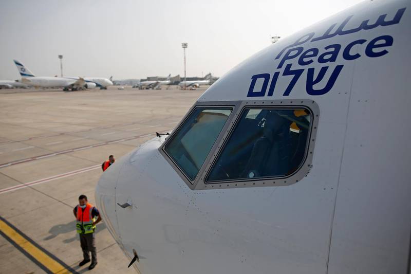 The Arabic, English and Hebrew word for 'Peace' is seen on the Israeli flag carrier El Al's airliner which carried Israel-US delegations to meet Emirati leadership in Abu Dhabi. AP