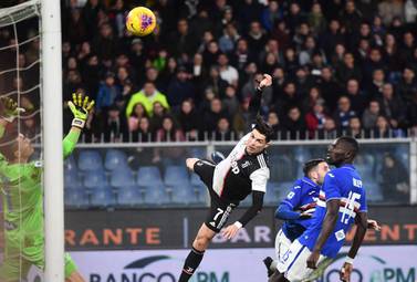 Juventus forward Cristiano Ronaldo leaps above the Sampdoria defence to score the winner. EPA