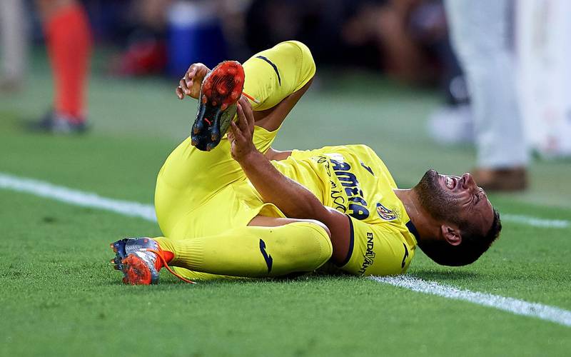SEVILLE, SPAIN - AUGUST 26:  Santi Cazorla of Villarreal CF lies injured on the pitch during the La Liga match between Sevilla FC and Villarreal CF at Estadio Ramon Sanchez Pizjuan on August 26, 2018 in Seville, Spain.  (Photo by Quality Sport Images/Getty Images)