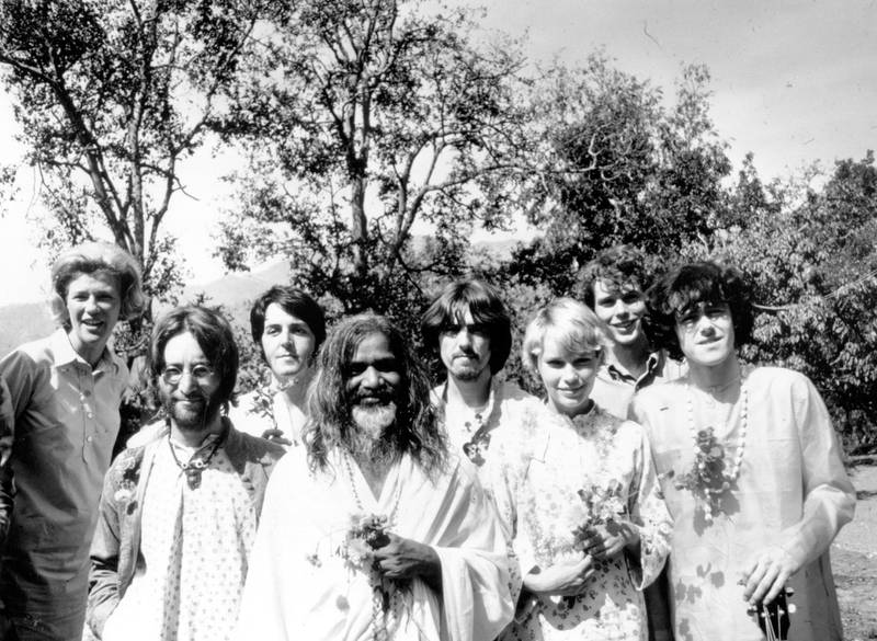 Maharishi Mahesh Yogi with members of the Beatles and other famous followers, who have chosen to study transcendental meditation at his academy in India, March 1968. Included in the group are, from left to right; unknown, John Lennon (1940 - 1980), Paul McCartney, Maharishi Mahesh Yogi, George Harrison (1943 - 2001), Mia Farrow, unknown, and Donovan. (Photo by Keystone Features/Hulton Archive/Getty Images)