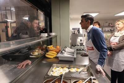 Serving breakfast on a visit to The Passage homeless shelter in London just before Christmas. Photo: Simon Dawson / No 10 Downing Street