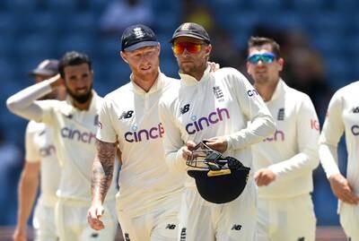 England captain Joe Root is consoled by Ben Stokes after losing the third Test - and the series - against West Indies at the National Cricket Stadium in Grenada on Sunday, March 27, 2022. Getty