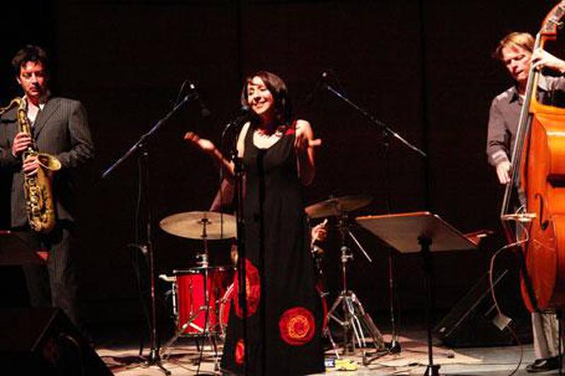 Rima Khcheich, singer, on stage with the Uri Honing Trio.