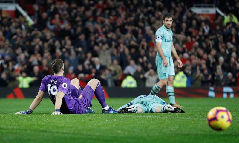 Arsenal's Bernd Leno, Sead Kolasinac and Sokratis Papastathopoulos look dejected after conceding the second goal scored by Manchester United's Jesse Lingard. Reuters