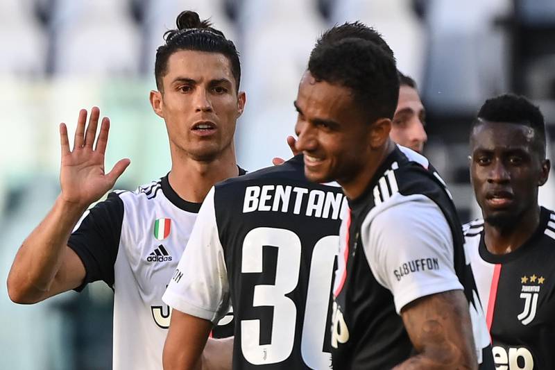 Juventus star forward Cristiano Ronaldo (L) celebrates with teammates at the end of the Serie A match against Torino. AFP