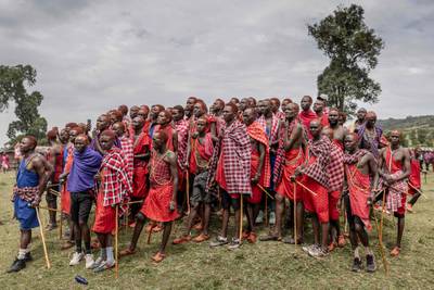 A group of Maasai men watch the ceremonial activities during the Eunoto ceremony in a remote area near Kilgoris, Kenya. AFP