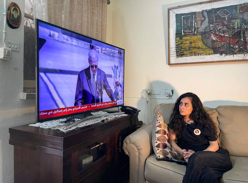 Lina Abu Akleh, niece of killed Palestinian American journalist Shireen Abu Akleh, watches US President Joe Biden speak after his arrival at Tel Aviv's Ben Gurion International Airport. AFP