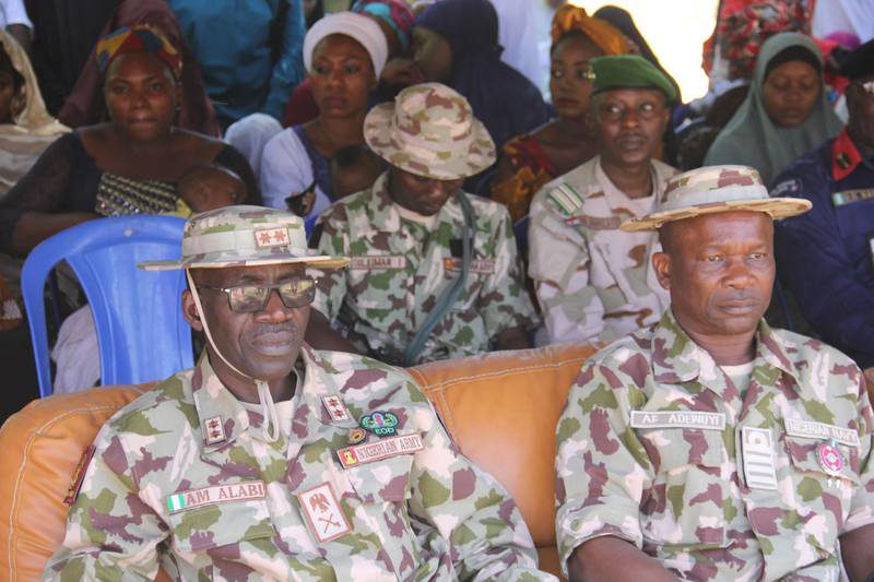 Nigerian Military officials are seen during an official ceremony, at the Giwa military barracks, where inmates  were released and handed over to  state officials for rehabilitation and integration after they were detained for up to four years over suspicion of links with Boko Haram jihadists in Maiduguri , on November 27, 2019. A total of 983 people incarcerated in a military facility in the northeast Nigerian city of Maiduguri were handed over to state officials for rehabilitation and integration.
Human rights groups have accused the Nigerian Military of indiscriminate mass arrests of innocent citizens in northeast Nigeria as it battles Boko Haram. / AFP / Audu Marte
