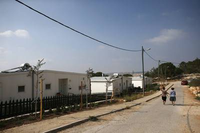 Israeli women walk in a Jewish settlement known as "Gevaot", in the Etzion settlement bloc, near Bethlehem on August 31, 2014. Israel announced on Sunday a land appropriation in the occupied West Bank that an anti-settlement group termed the biggest in 30 years. Ronen Zvulun/Reuters