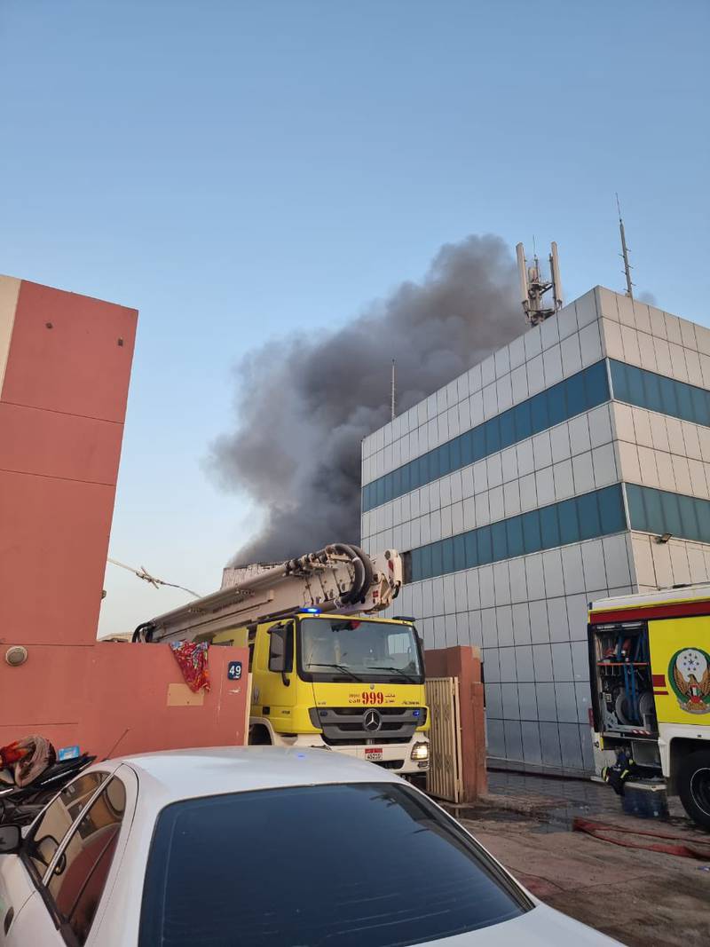 Abu Dhabi Police and Abu Dhabi Civil Defence teams deal with a fire at a warehouse in the Mussaffah Industrial Area. Photo: Abu Dhabi Police
