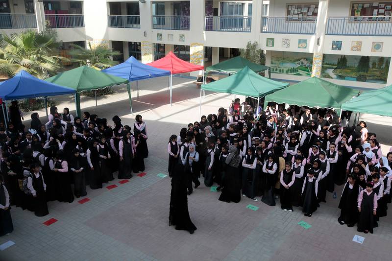 Dubai, United Arab Emirates - September 8, 2013.  Students from grade 6 to 9 were assembled to start their program, to sing their national anthem, hear their principal's welcoming remarks and some raffle draws.  First day of school in Nadd Al Hamar Primary School for Basic Education Cycle 2.  ( Jeffrey E Biteng / The National )  Editor's Note; Wafa I reports.  Some restrictions to observe on taking photos in a girls school. *** Local Caption ***  JB080913-Publicschool03.jpg