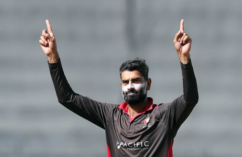 UAE's Ahmed Raza takes the wicket of Nepal's Aarif Sheikh. Chris Whiteoak / The National