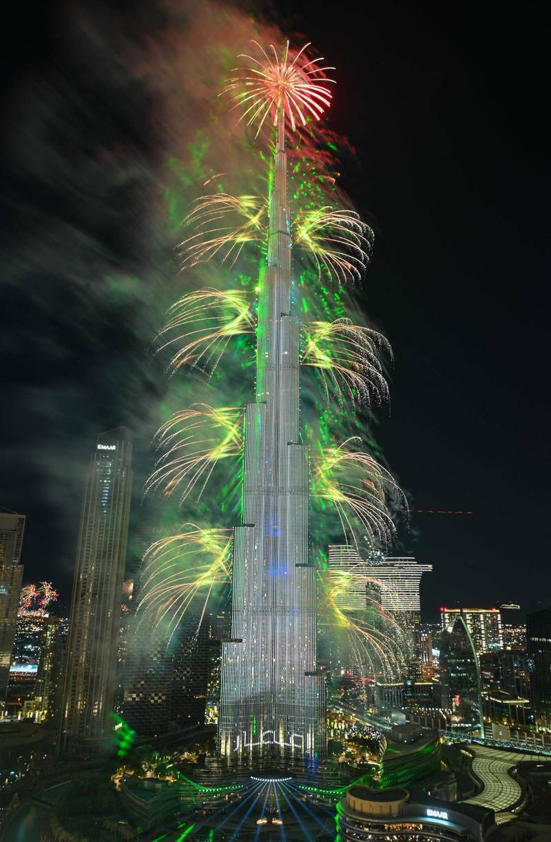 The world’s tallest tower shines brightly in a dazzling array of colours and lights on the stroke of midnight. AFP