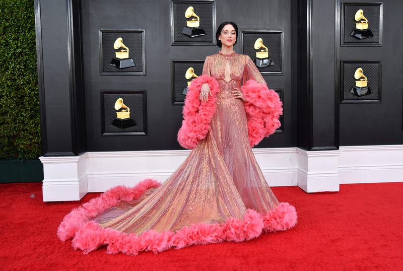 St Vincent, wearing a resplendent pink dress with ruffled sleeves. AFP