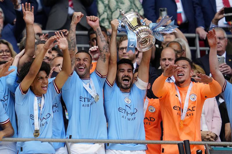 Manchester City captain Ilkay Gundogan lifts the FA Cup after their victory against Manchester United at Wembley Stadium. AP 
