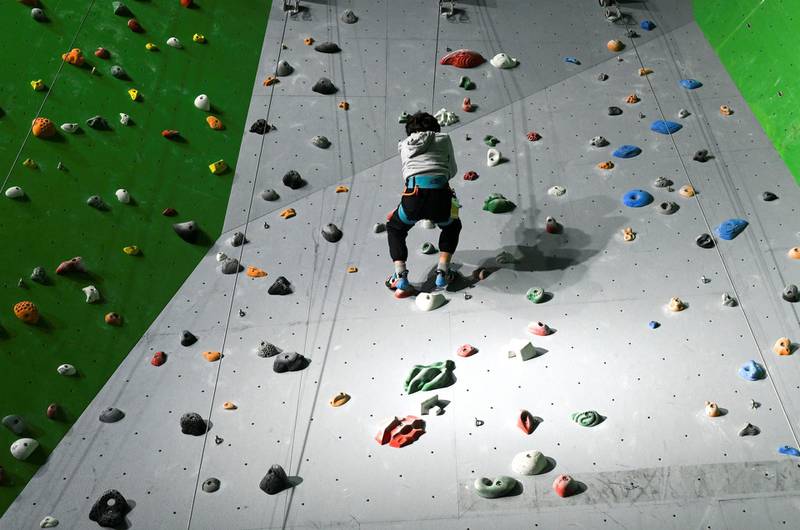 Abu Dhabi, United Arab Emirates - Mazen, 7,  reaches heights during the indoor climbing at CLYMB, Yas Island. Khushnum Bhandari for The National