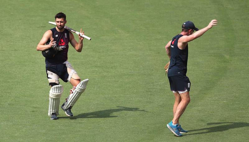 England's Mark Wood,left, walks back dancing at the end of a training session with his team player ahead of the first T20 against India in Ahmedabad on Thursday, March 11. AP