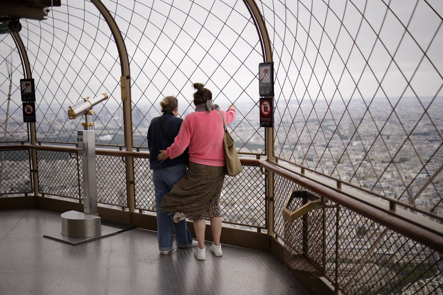 Visitors enjoy the view on the reopening day of the Eiffel Tower in Paris. EPA