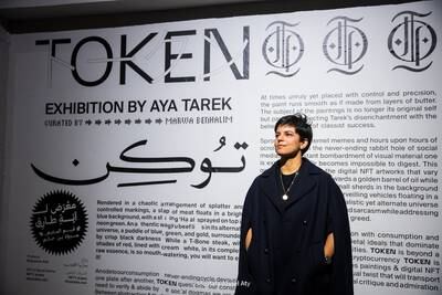 Egyptian visual artist Aya Tarek attends the launch of her latest exhibition Token, which opened in Downtown Cairo's Kodak Passageway on Thursday. Photo: Marwa Benhalim