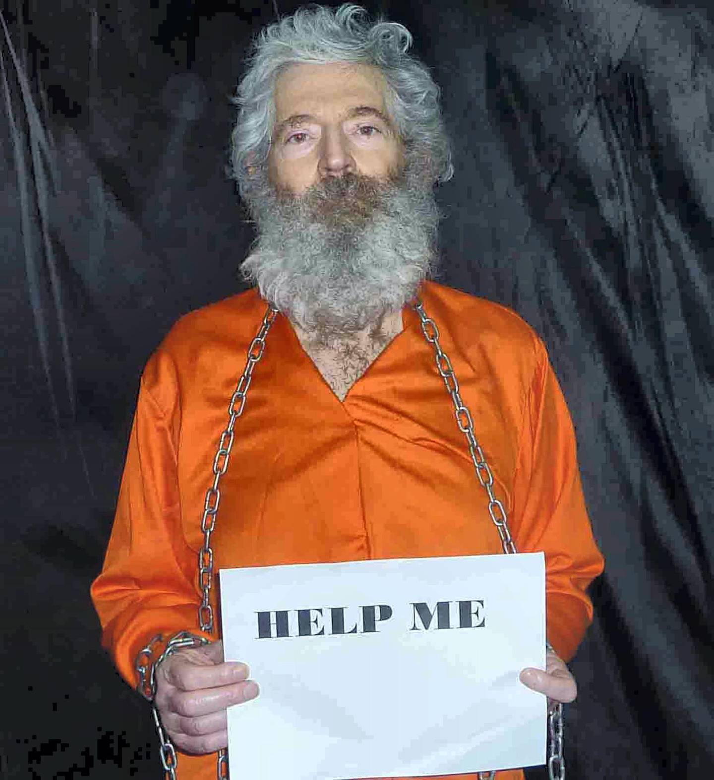 This Image provided by the Federal Bureau of Investigation(FBI) shows a photo of former FBI agent Robert Levinson, who went missing on Kish Island, Iran, on March 9, 2007, shackled and holding a sign. The United States announced a $5 million increased reward March 9, 2015 for information leading to the return of Levinson, as it marked the eighth anniversary of his mysterious disappearance in Iran. The FBI had previously issued a $1 million reward for Levinson's return in 2012, five years after he went missing.    AFP PHOTO / HANDOUT / FBI                         == RESTRICTED TO EDITORIAL USE / MANDATORY CREDIT: "AFP PHOTO / HANDOUT / FBI "/ NO MARKETING / NO ADVERTISING CAMPAIGNS / NO A LA CARTE SALES / DISTRIBUTED AS A SERVICE TO CLIENTS == (Photo by -- / FBI / AFP)