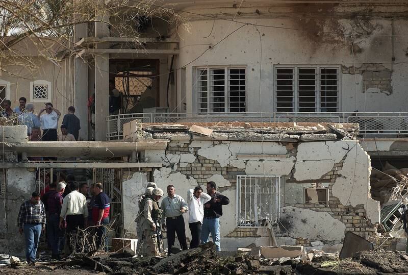 US military personnel and Iraqi security forces investigate the scene of a deadly car bomb attack on the International Committee of the Red Cross HQ in October 2003, in Baghdad. Getty Images