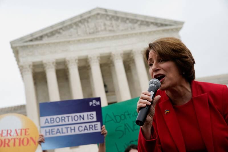US Senator Amy Klobuchar speaks at a protest outside the US  Supreme Court after the leak of a draft majority opinion written by Justice Samuel Alito preparing for a majority of the court to overturn the landmark law known as Roe v  Wade. Reuters