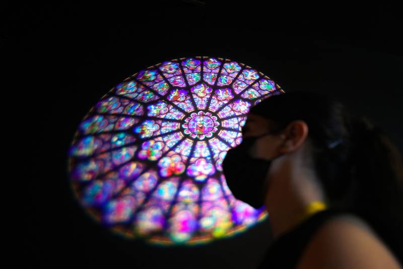 A projection of the Rose, a 13th century stained glass window at Notre Dame, at the French pavilion. Chris Whiteoak / The National