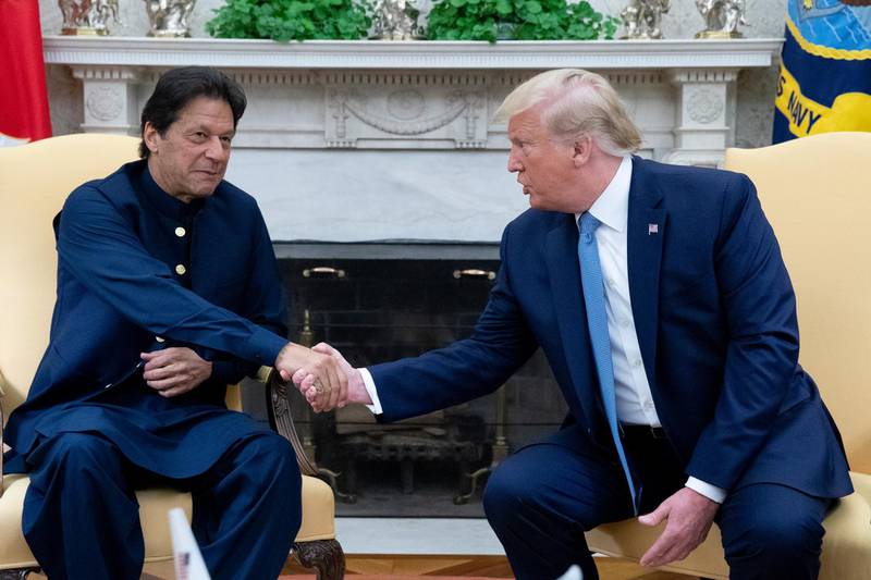 US President Donald Trump and Prime Minister of Pakistan Imran Khan shake hands during their meeting in the Oval Office of the White House. EPA