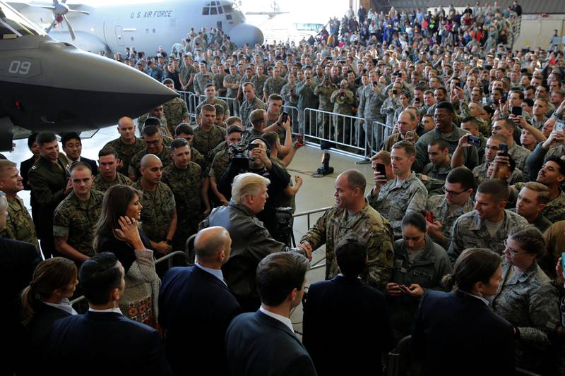 US president Donald Trump greets members of the US military at Yokota Air Base, Japan. Jonathan Ernst / Reuters