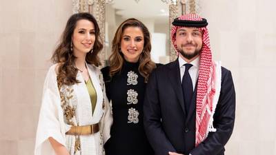 Princess Rajwa wears a gold belt that belongs to Queen Rania for the official portrait released to mark her engagement to Crown Prince Hussein, right. Photo: Royal Hashemite Court