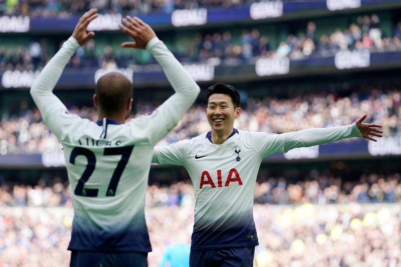 epa07503593 Tottenham's Lucas Moura (L) celebrates with teammate  Son Heung-min (R) after scoring during the English Premier League game between Tottenham and Huddersfield at the Tottenham Hotspur Stadium, London, Britain, 13 April 2019.  EPA/WILL OLIVER EDITORIAL USE ONLY. No use with unauthorized audio, video, data, fixture lists, club/league logos or 'live' services. Online in-match use limited to 120 images, no video emulation. No use in betting, games or single club/league/player publications